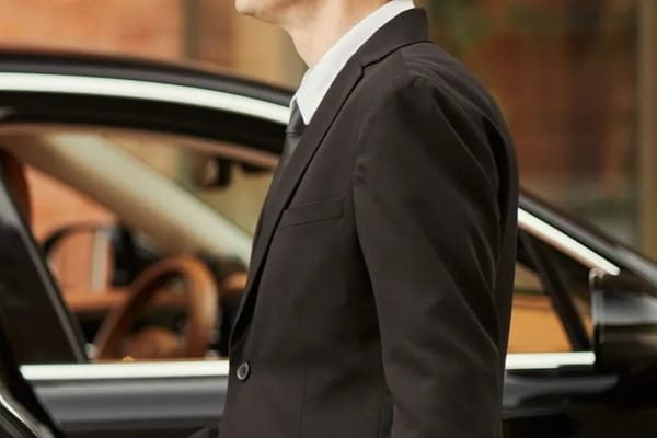 Luxury black car at night city lights